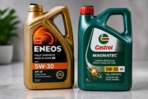 Kanistry olejów silnikowych Eneos 5W-30 i Castrol Magnatec 5W-30 na stole