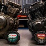 Dwa silniki motocyklowe Yamaha z olejami Castrol Power1 i Motul 7100 10W-40 na warsztatowym stole